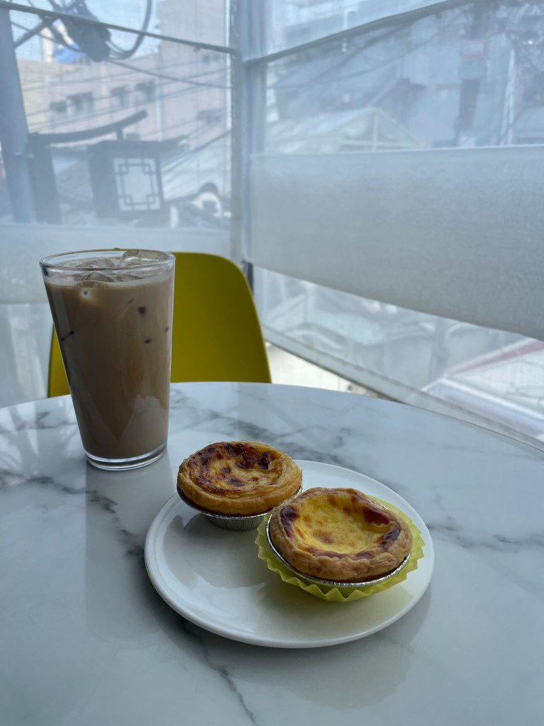 Iced coffee, Macau Egg Tart (upper left), Durian Egg Tart (bottom right)
