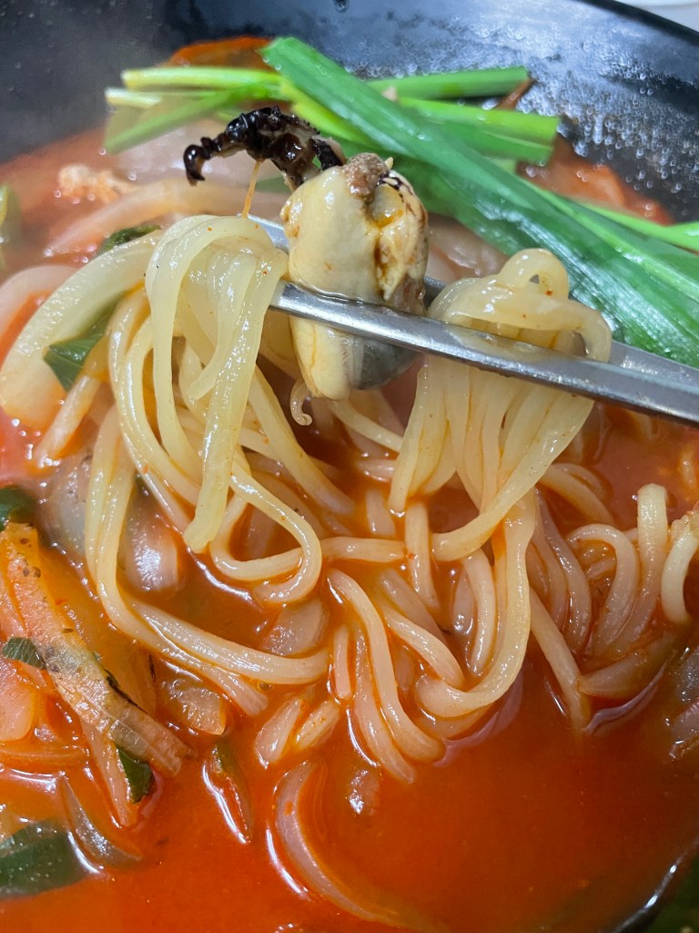 Firm and chewy noodles mixed with spicy broth