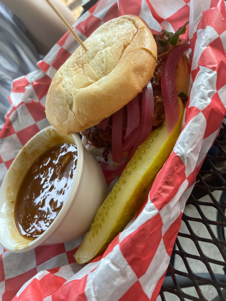 BBQ pulled pork sandwich with baked beans