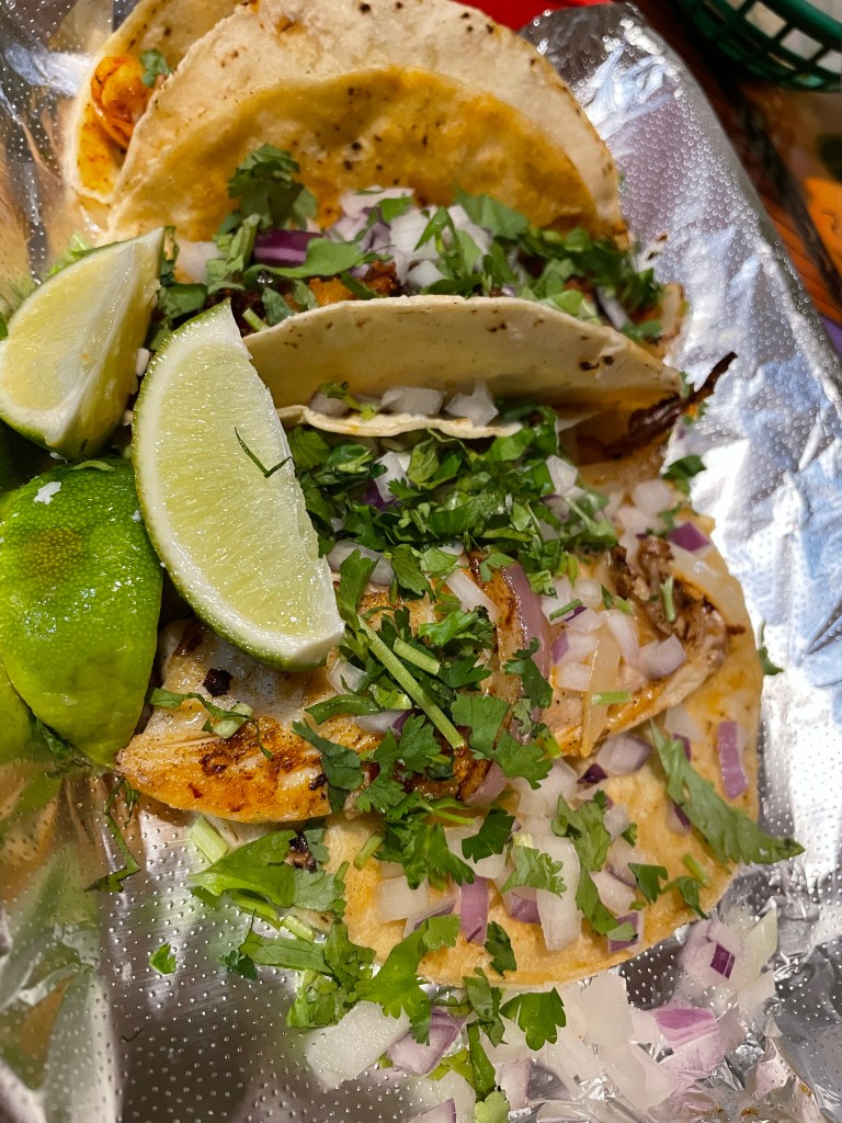 Fish taco (bottom), Chorizo taco (middle), and Al pastor (top)