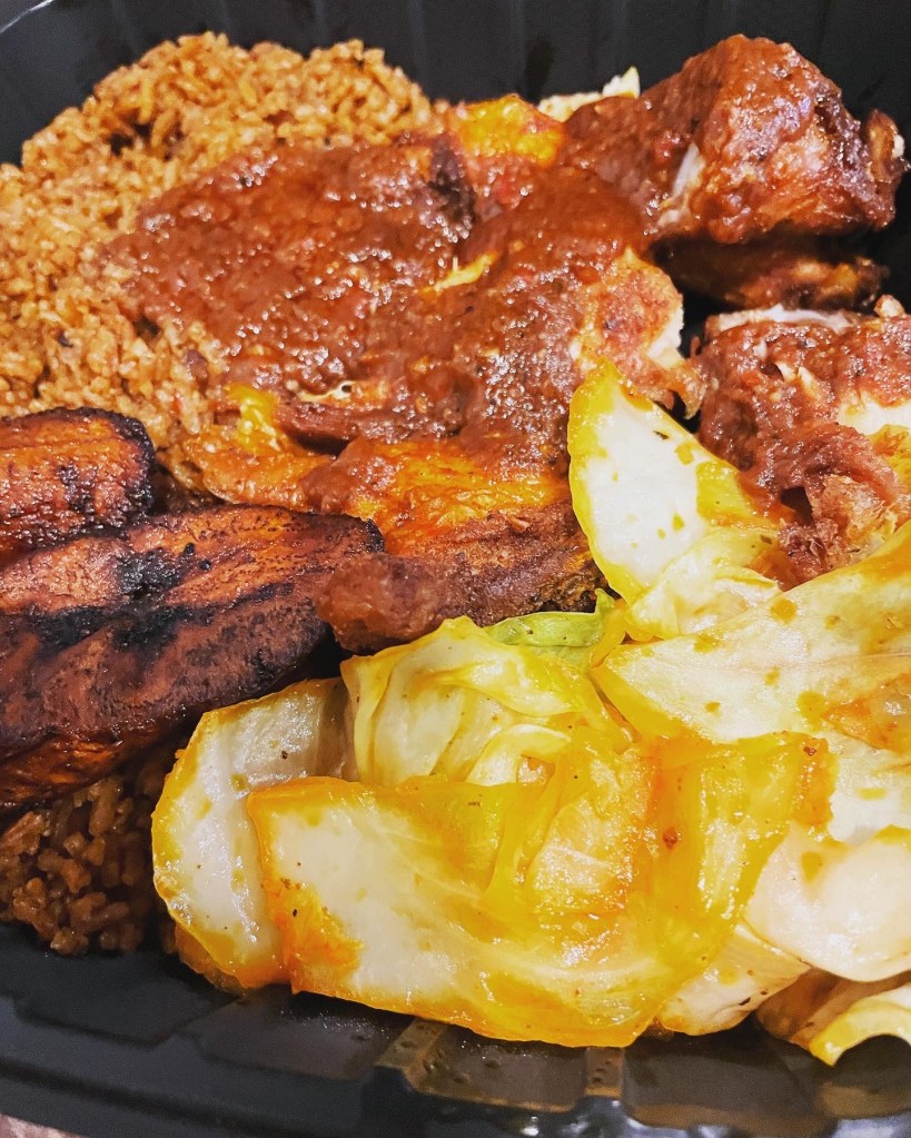 Fried chicken with jollof, cabbage, and plantains